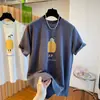 Camiseta Creativa Estampada de Manga Corta para Mujer 2026 Verano Nuevo Diseño de Nicho Hombro Derecho Talla Grande Suelto Top para Mujer