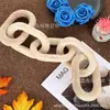 Hebilla de cinco anillos de madera de paulownia personalizada de fábrica cadena de madera creativa anillo decorativo adorno de decoración de escritorio decoración de cadena de madera
