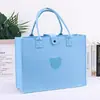 Bolsas de fieltro tipo tote de oso de peluche, hechas a medida y de gran capacidad, adecuadas para eventos corporativos, banquetes de negocios y como bolsas de regalo de fieltro portátiles; impresión de logo disponible