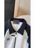 Sudadera de Terciopelo con Media Cremallera para Hombre 2025 Primavera y Otoño Nuevo Diseño de Empalme en Contraste de Color Blanco y Negro