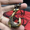 Yiwu joyería al por mayor colgante de anzuelo de pez maorí de resina vintage colgante de collar de imitación de dientes Transfronterizo Collier
