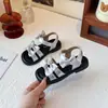 Sandalias para Niñas Estilo Coreano Moño Niña Pequeña Punta Abierta Zapatos de Playa 2026 Nuevo Verano Versátil Zapatos de Princesa