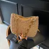 Bolsa de Palha Tecida Estilo Pastoral Comércio Exterior Feminina 2025 Nova Bolsa de Praia Tecida para Férias na Beira-Mar Moda Bolsa de Ombro com Corrente