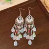 Pendientes grandes de flor estilo resort junto al mar, artículo de venta caliente de rafia, pendientes de botón de estrella de mar de lujo ligero de alta gama, pendientes de nicho y elegantes