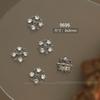 Explosiones de red de celebridades Buchelati arte de uñas joyería de circón estrellas aleación de cuatro hojas hueco diamante accesorios para uñas al por mayor