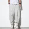 Pantalones Harem Casuales de Lino para Hombre Estilo Chino Otoño 2021 Rayas Retro Combinación de Colores Sueltos Algodón y Lino Botón de Disco