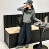 Conjunto de Ropa de Otoño para Niñas 2026 Nuevo de Moda Primavera y Otoño Niños Grandes Camiseta de Manga Larga y Pantalones a Cuadros Conjunto de Dos Piezas