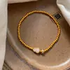 Pulsera de Calabaza de Jade Blanco Retro Nueva Chinoiserie de Oro Antiguo Chapada en Oro Real para Mujer Pulsera de Alta Gama Pulsera de Abalorios de Nicho