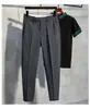Pantalones casuales nuevos para hombre, estilo primavera y otoño, pantalones finos elásticos para hombre de verano, longitud de nueve puntos, negros