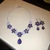 Conjunto de brincos e colar com pingente de flor de zircônia e gota d'água, de design moderno, acessórios versáteis para mulheres.