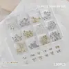Accesorios para Uñas Artísticas Caja de 12 Compartimentos Mariposa Metálica Mixta Cuervo Corazón Cruz Cinta Lazo Decoración para Uñas de Forma Especial