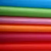 Tela no tejida de polipropileno de color fabricantes de tela no tejida tela no tejida spunbond pp rollo tela a prueba de frío almacenamiento textil para el hogar a prueba de polvo