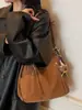 Nueva mochila retro 2026 para mujer, colección otoño/invierno, con un diseño lindo y elegante, gran capacidad, bolso de hombro casual y un bolso tote moderno y minimalista