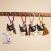 Madera de Haya Natural Talla Kuromi Incrustado con Ébano Negro Colgante Llavero Decoración para Bolso Artesanías de Madera al por Mayor
