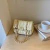 Bolso de mano bandolera cadena pequeño cuadrado mujer 2026 otoño nuevo elegante sensación de alta gama un solo hombro bandolera bolso de mujer