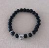 Venta caliente transfronteriza nueva 8 mm piedra negra esmerilada cabeza de leopardo dorada antigua plata cabeza de león pulsera elástica para hombres y mujeres venta al por mayor
