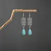 Brincos turquesa estilo étnico vintage europeu e americano, brincos pendentes de borla turquesa boêmios, brincos mais vendidos das áreas cênicas de Yunnan