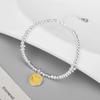 Pulsera Carlene de plata de ley 925 con carita sonriente amarilla y estrella de circonita en polvo.