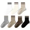 Calcetines de algodón puro para mujer Zhuji, de media pantorrilla, para primavera y otoño, con un elegante diseño de rayas, adecuados para deportes, resistentes al olor, antibacterianos y sin costuras. Disponible al por mayor