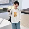 Camiseta de manga larga de algodón puro para niños, versátil top de dibujos animados nuevo para primavera y otoño 2026, camiseta básica para niños, ropa para niños talla mediana y grande