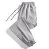 Novos Calças Esportivas Casuais Masculinas Primavera e Outono Estilo Coreano Calças Cropped Largas Calças de Moletom Casuais Caneladas Marca Tendência Masculina