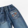 Jeans de niño 2025 Primavera y Otoño Pantalones nuevos para niños Jeans de color puro con dibujos animados para bebé para ropa exterior