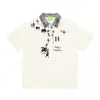 Savagebase Camiseta Polo Estampado de Dibujos Animados Splash Callejero Americano Verano 2026 Cuadros Empalmados Mangas Cortas