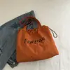 Bolsa de Axila Estilo Perezoso Estilo Coreano al por Mayor para Mujer 2025 Nuevo Bolso Tote con Estampado de Letras Bolso de Hombro Único de Tela
