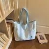 Bolso tote simple de gran capacidad, nuevo bolso tote casual de lona de color liso, estilo moderno, bolso de hombro para el trabajo, principios de otoño 2026