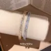 Pulsera circular envuelta en circonitas estilo francés, lujo ligero, alta gama, moderna y exquisita, joyería versátil elegante de nicho para mujer