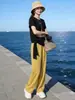 Conjunto deportivo para mujer estilo europeo 2026 nueva colección de verano, diseño elegante y juvenil, conjunto de dos piezas irregular de manga corta, moderno