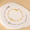 Venta al por mayor del fabricante Pulsera de Acero de Titanio Cruzada Chapada en Oro de 18K para Mujer Cadena Cruzada Clip Pulsera de Bolas Joyería de Moda Popular