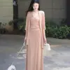 Conjunto de primavera y verano: un nuevo conjunto de estilo maduro ligero, puro y seductor, moderno y versátil conjunto de dos piezas de cárdigan de punto y falda