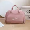 Bolsa de viagem portátil feminina direto da fábrica bolsa de bagagem bolsa de presente em PU tamanho bolsa à prova d'água bolsa de ombro para viagens de curta duração