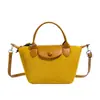 Bolso de mano diario transfronterizo modelo 2026 para mujer, bolso nicho de cuero vintage tipo albóndiga, bolso de hombro y cruzado para el trabajo
