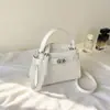 Bolso de mujer de alta calidad con estampado de piedra, nuevo bolso de hombro simple de moda 2026, bolso cruzado para el trabajo, bolso de mano de lujo ligero