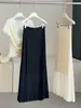 Saia Midi Preta com Textura Simples Feminina Verão Cintura Alta Fluida Emagrece Cobre os Quadris Versátil Evasê Elegante Saia Longa