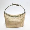 Bolsa de mano tejida a mano de fibra de hoja de coco, de estilo veraniego transfronterizo, moderna, versátil, con asa de muñeca, bolsa para lonchera tejida