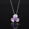 Otoño e invierno Nueva joyería Zhuang Sheng diamante de alto carbono Flor de hielo corte cobre incrustado pétalos ligero colgante de lujo piedra principal femenina 8*8