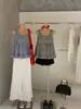 Wgwe9097 Ropa de Mujer Guangzhou Shisanxing Verano Nueva Camisa sin Mangas con Parche de Volantes a Cuadros y Tirantes de Moda