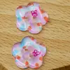 Artículos nuevos en stock color transparente flores estampadas botones DIY ropa zapatos calcetines accesorios Crocs parches botones de resina de dos agujeros