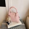 Bolso de mano de alta gama para mujer, primavera y verano 2025, nuevo, sencillo, para ir al trabajo, bandolera de hombro, bolso informal coreano con forma de concha