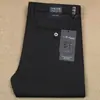 Pantalones casuales lisos de algodón elástico de fibra de poliéster grueso para otoño e invierno, de color sólido, para hombre, de oficina, de negocios, brillantes