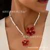Um Colar Pingente de Flor Plumeria com Esmalte Fashion para Mulheres Usarem em Festas de Feriado