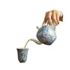Tetera taza de té de cerámica de alta calidad azul plateado y oro blanco y plata belleza equivocada para el hogar una olla dos tazas juego de té kung fu caja de regalo