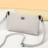 Nova bolsa pequena de couro macio, simples e estilosa, bolsa de mão de alta qualidade, bolsa de ombro, bolsa pequena, bolsa para celular, bolsa feminina, transfronteiriça