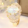Anel de estilo explosivo transfronteiriço com pedra principal de opala oval Anel de dedo de opala em forma de ovo com cravação total em diamantes em ouro