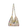 Bolso Tote de Flores de Alta Gama para Viajeros de Gran Capacidad para Mujer 2025 Nuevo Primavera y Verano Bolso Tejido Calado de Un Solo Hombro Bolso Tejido