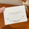 Pendientes pequeños diarios dorados simples tres pares de traje aguja de plata para mujer estudiante exquisitos pendientes de estrella de mariposa al por mayor