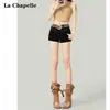 Shorts de Mezclilla Negros Estilo Americano de Tiro Bajo para Mujer, Modelo Nuevo de Verano 2025 a la Moda con Remaches, Ajustados, que Resaltan la Cadera, de Corte A, Hot Pants